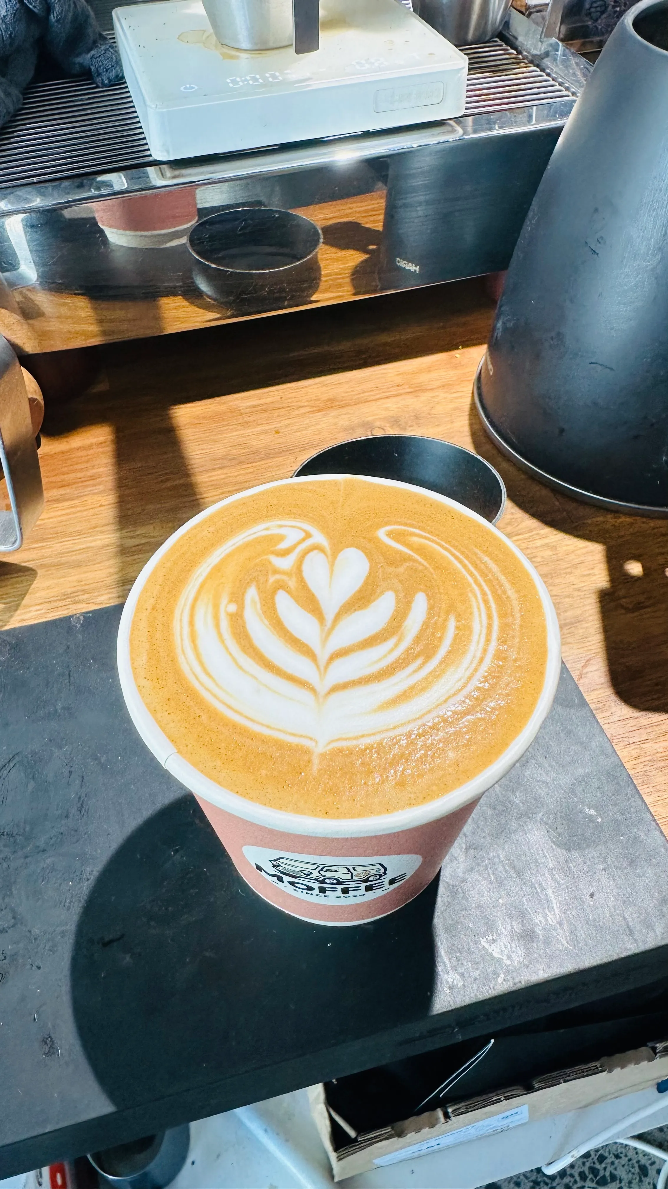 Fresh latte with latte art from Moffee
