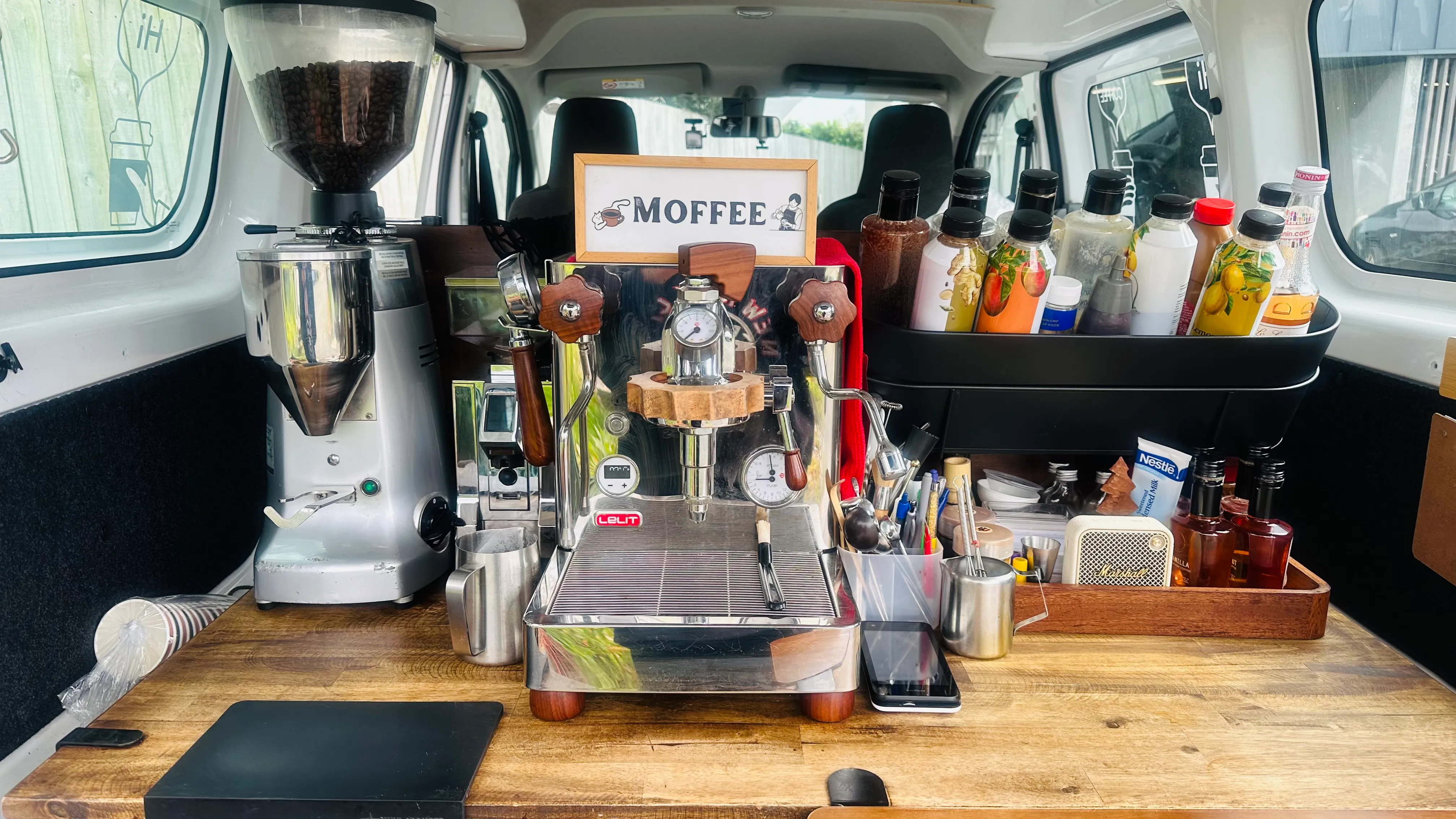 Moffee espresso machine and coffee setup inside the mobile van