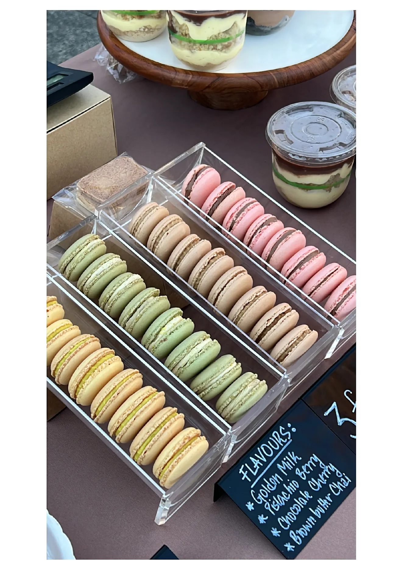 Pastels colourful handmade macarons and dessert cups