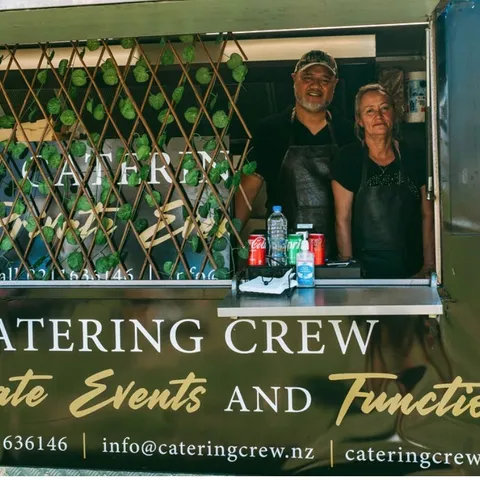 Tony and Tonya serving from the Catering Crew food truck window